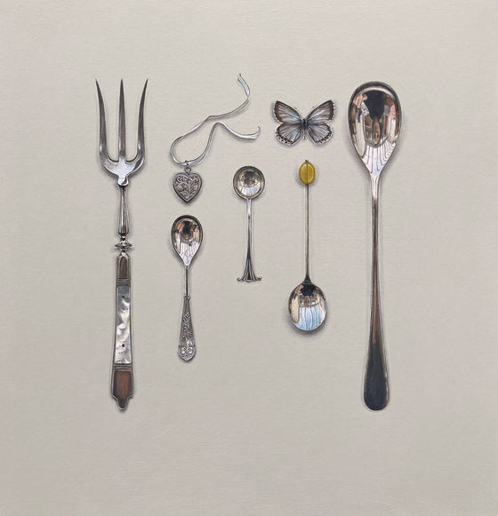 Silverware Arrangement with Locket and Blue Butterfly
