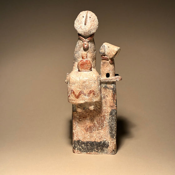 Seated Figure with Flask and Distracted Dog